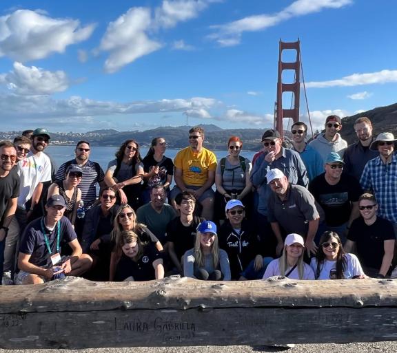 group of people in front of golden gate bridge