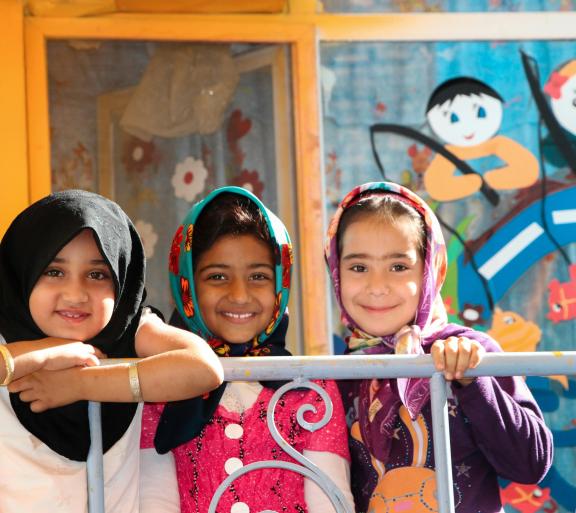 three girls in headscarves