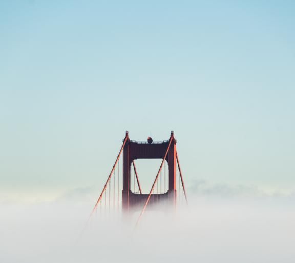 top of golden gate bridge in fog
