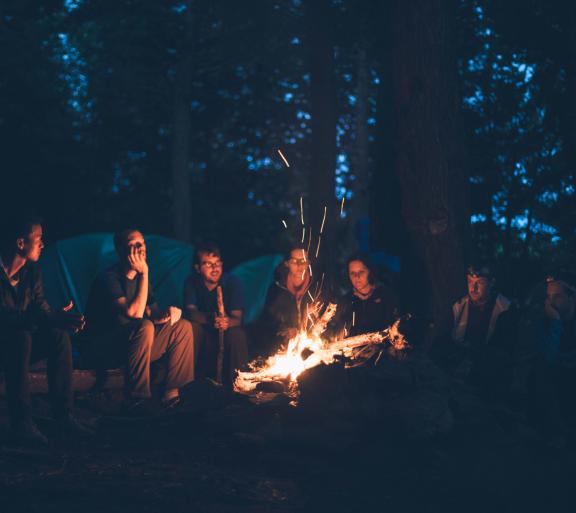 people around a campfire