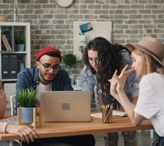 people all around a computer