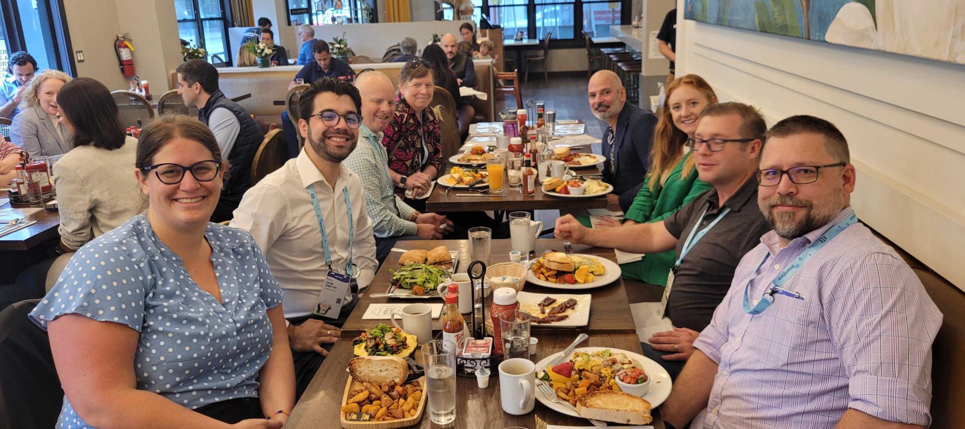 people seated around restaurant table