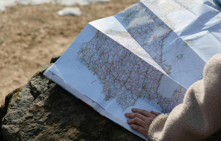 hand on map