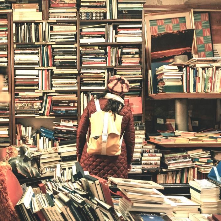 woman in a messy book store