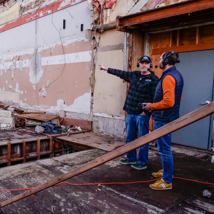 two journalists in demolished building