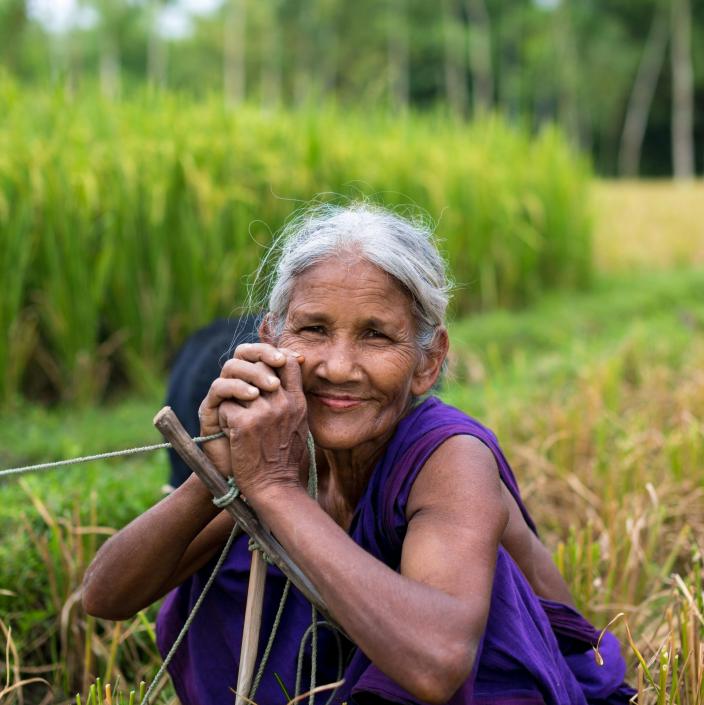 woman smiling in farm field