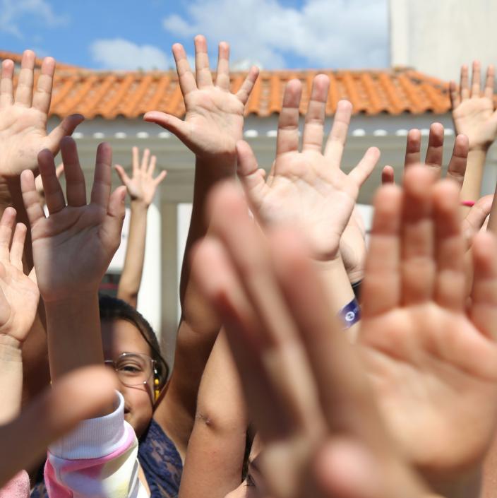 kids raising hands