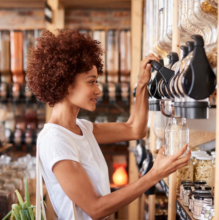 woman using coffee dispenser