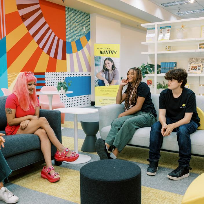 young people sitting on sofas