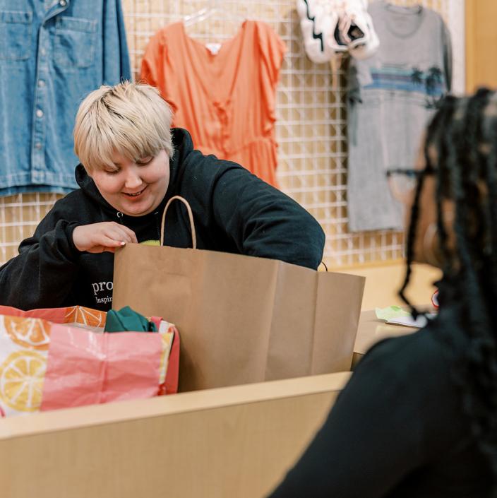 person packing shopping bag