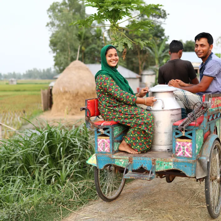 people riding in a cart