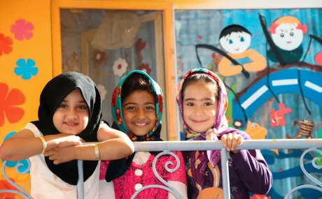 three girls in headscarves