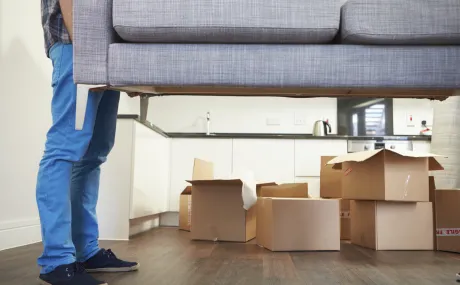 man moving a couch