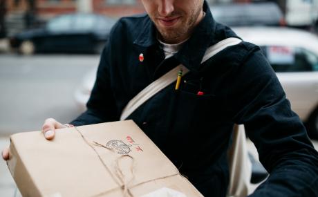 person holding package