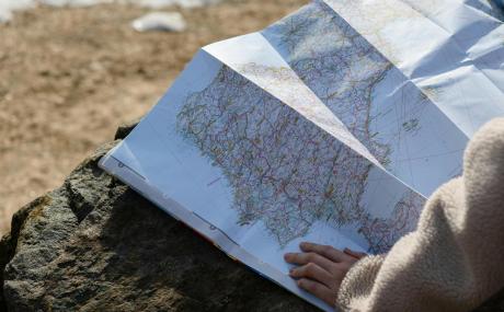 hand on map