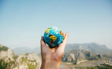 hand holding globe
